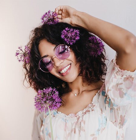 happy-african-female-model-with-short-hair-smiling-with-eyes-closed-indoor-photo-pleased-black-girl-posing-with-purple-flowers-2