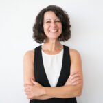 Happy successful woman posing with folded arms