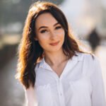 Portrait of woman in white shirt